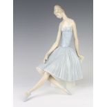 A Lladro figure of a seated ballerina no.4559 34cm