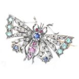 A silver gilt novelty butterfly brooch set with diamonds, rubies, sapphires and emeralds 40mm, 7.1