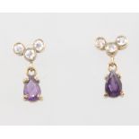 A pair of 9ct yellow gold pear cut amethyst and diamond ear studs, the amethysts approx. 0.5ct,