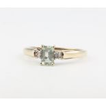 A 9ct yellow gold aquamarine and diamond ring 1.6 grams, size O