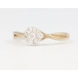 A 9ct yellow gold diamond daisy cluster ring, 2 grams, size P