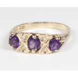 A 9ct yellow gold amethyst and diamond ring size O, 2.5 grams
