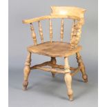 A 19th Century light elm bow chair with solid elm seat and double H framed stretcher There is some