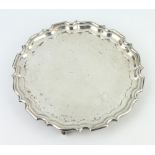 A silver card tray with Chippendale rim on scroll feet, Sheffield 1955, 20cm, 205 grams