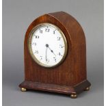 A French 8 day bedroom timepiece with enamelled dial and Arabic numerals contained in a mahogany