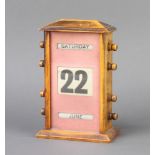 A 19th Century perpetual calendar contained in a beech case 13cm x 13cm x 7.5cm There is a section