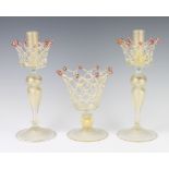 A pair of Murano glass candlesticks with basket work necks 31cm together with a ditto centre piece