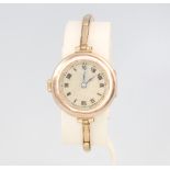A lady's 9ct yellow gold wristwatch on a ditto expanding bracelet, gross 18.5 grams This watch is
