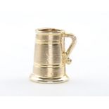 A 9ct yellow gold charm in the form of a mug 1.2 grams