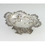 A Victorian repousse silver pedestal bon bon dish with pierced scroll decoration London 1895,