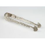 A pair of Georgian silver sugar tongs with floral decoration 40 grams