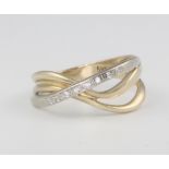 A 14ct 2 colour gold and diamond crossover ring 3.5 grams, size N 1/2