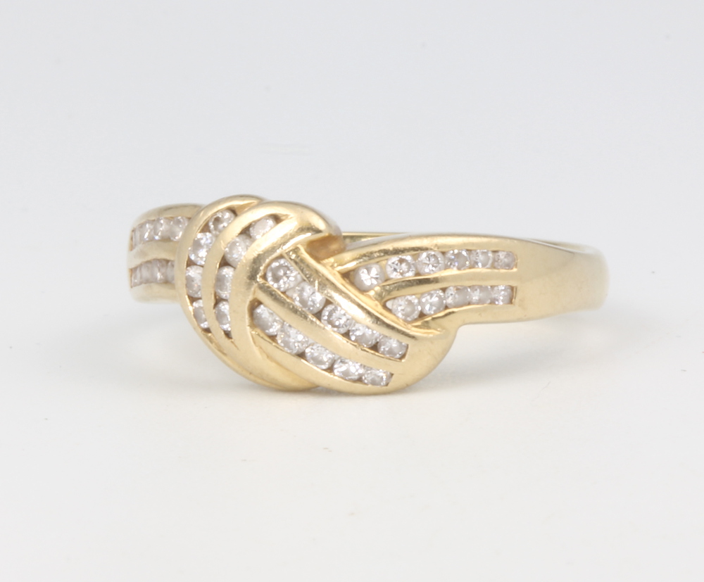 An 18ct yellow gold diamond crossover ring, 4.8 grams, size Q