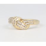 An 18ct yellow gold diamond crossover ring, 4.8 grams, size Q