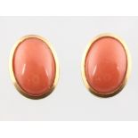 A pair of 18ct yellow gold oval cabochon cut coral ear studs 3.6 grams, 15mm