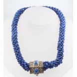 A lapis lazuli bead necklace with repousse silver clasp 36cm