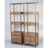 A pair of Oriental hardwood 3 tier what not stands fitted 6 short drawers above double cupboard