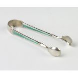 A pair of Continental silver and guilloche enamel sugar tongs, 20 grams