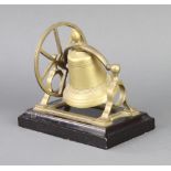 A brass table bell raised on ebony base 17cm x 18cm x 12cm