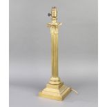 J Hinks & Sons, a Victorian brass reeded column table lamp with Corinthian capital on a stepped base