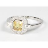 A platinum Art Deco style yellow sapphire and diamond ring the centre stone approx. 1.2ct, size O,