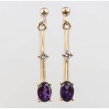 A pair of 9ct yellow gold amethyst and diamond drop earrings, amethysts approx. 1ct, the diamonds