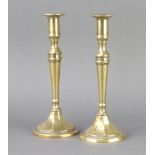 A pair of 19th Century brass candlesticks 25cm x 10cm