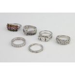 A silver paste ring size M and 4 others