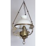 A Victorian gilt metal hanging oil lamp with an associated opaque glass shade 100cm h x 45cm diam.