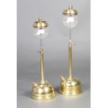 Two brass tilley lamps complete with glass shades 56cm x 19cm