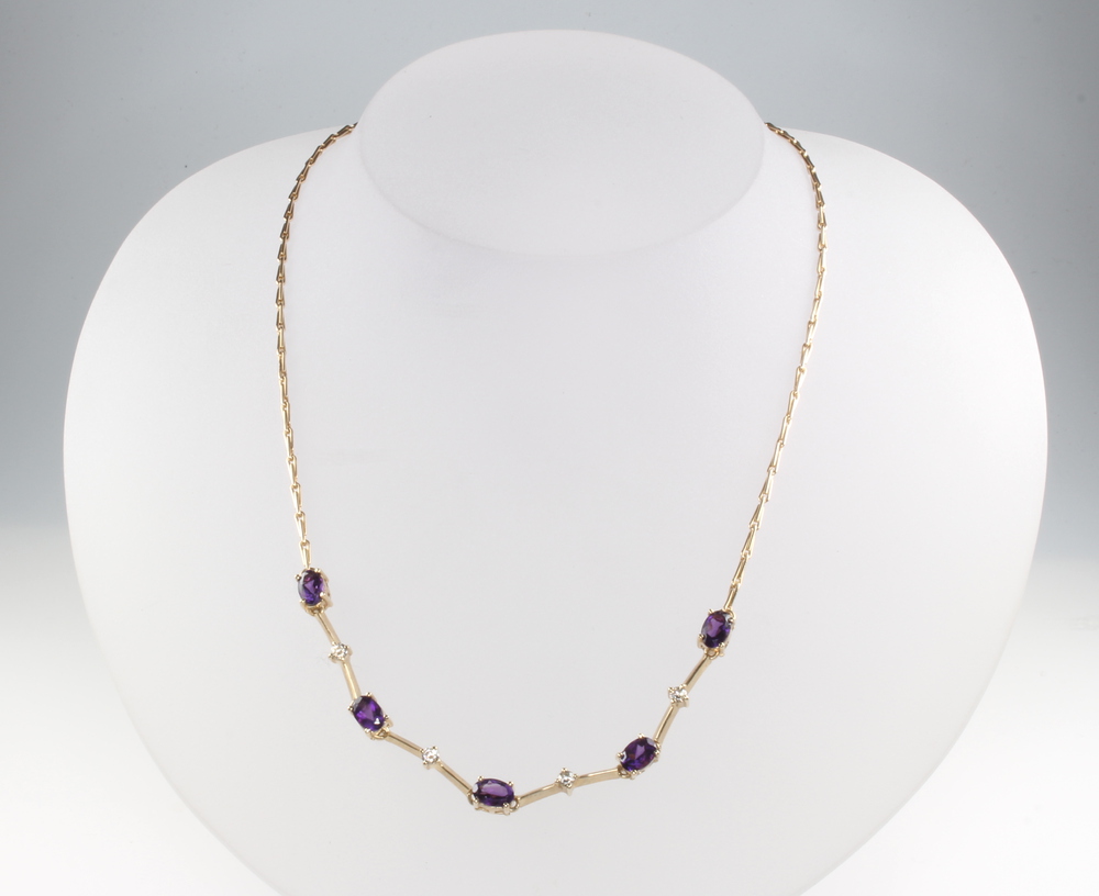 A 9ct yellow gold 4 stone diamond and 5 stone amethyst necklace, the amethysts 2ct, the diamonds 0.