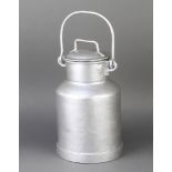 A cylindrical metal milk carrier 29cm h x 18cm diam.