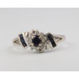 An 18ct white gold sapphire and diamond ring, 2.7 grams, size P