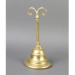 A Victorian bell shaped brass door stop 24cm x 12cm x 6.5cm