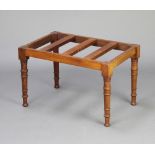 A Victorian rectangular mahogany slatted luggage rack, raised on turned supports 39cm h x 63cm w x