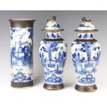 A pair of Chinese crackle glazed oviform vases and covers decorated with figures in gardens 37cm