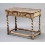 A 17th Century style carved oak side table with shaped apron fitted 2 drawers, raised on spiral