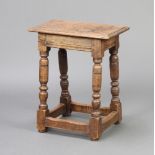 An 18th Century style bleached oak joined stool raised on turned and block supports with box