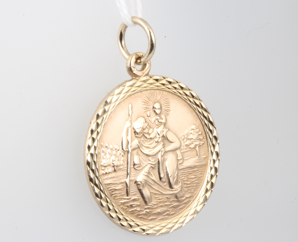 A 9ct yellow gold circular St Christopher pendant 5.7 grams