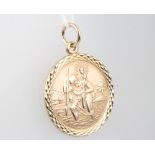 A 9ct yellow gold circular St Christopher pendant 5.7 grams