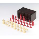 A 19th Century turned and stained ivory chess set, the king 9.5cm, contained in a mahogany box