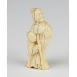 A Meiji period carved ivory Netsuke of a standing lady and child 5.5cm