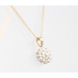 A 9ct yellow gold necklace 44cm with a diamond cluster pendant, 8mm, 2 grams