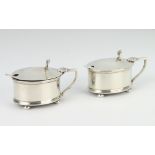 A pair of oval silver mustards on ball feet Birmingham 1946, 92 grams