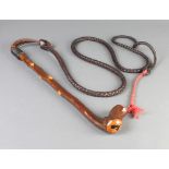 A hunting whip with shalaylee style handle and woven leather lash, the whip is 45cm, the leather