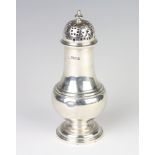 A silver sugar caster of baluster form London 1929, 220 grams