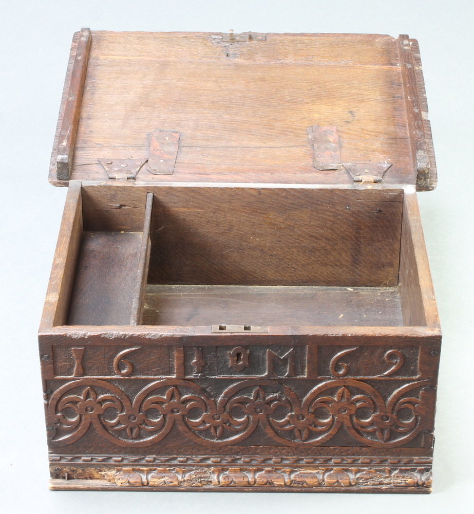 An 18th/19th Century carved oak bible box with hinged lid and iron butterfly hinges, the apron - Image 3 of 3