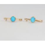A pair of yellow gold turquoise brooches 3.2 grams