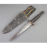 A Fairbairn Sykes type dagger with 17cm blade and brass cross bar, complete with leather scabbard