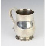 A silver baluster mug with S scroll handle London 1934, 427 grams